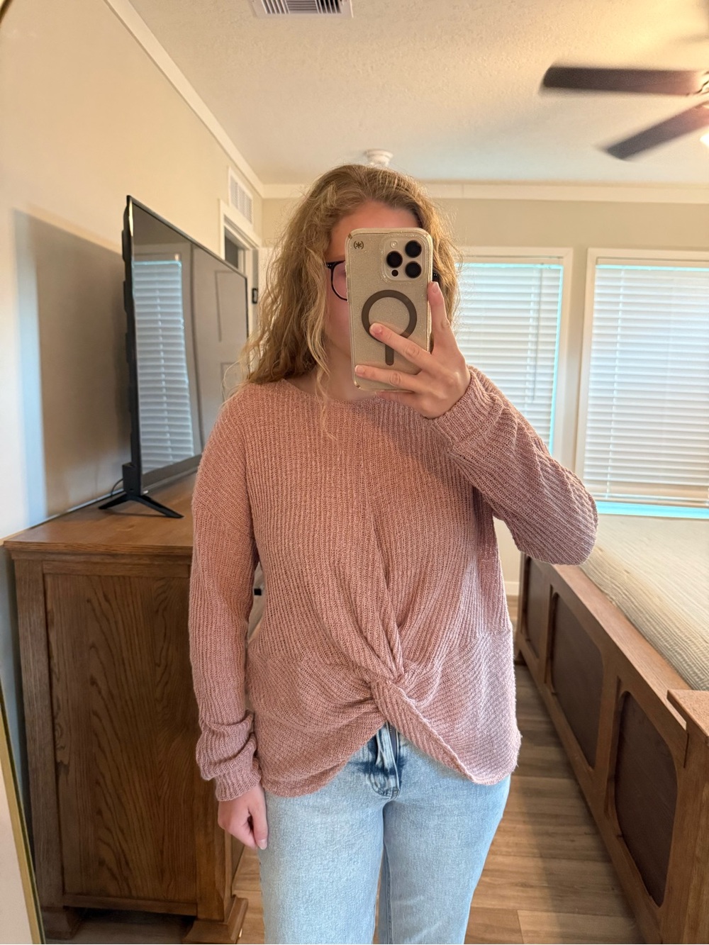 Pink ribbed knit sweater with tie front detail. Slightly see through. 
-Size L
